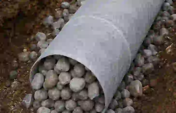 Exterior foundation waterproofing membrane and weeping tile drainage system installation