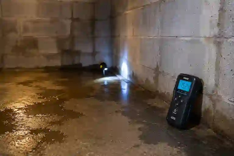Interior basement moisture inspection identifying seepage areas and hydrostatic pressure conditions in an Ontario basement.