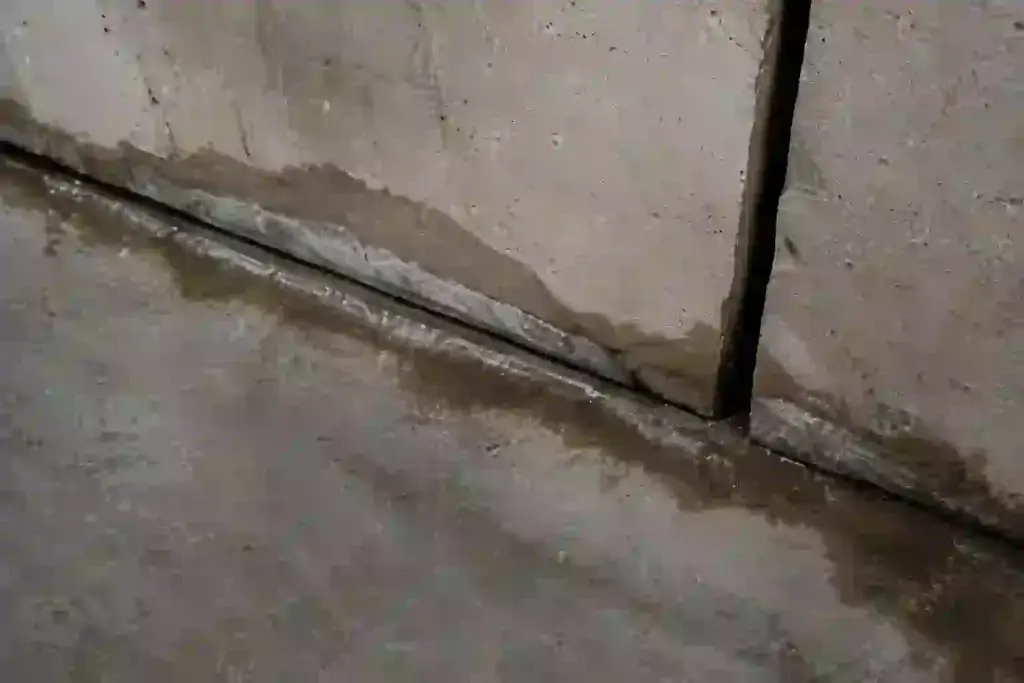 Residential Ontario basement wall showing inward movement and separation associated with bowing foundation wall pressure